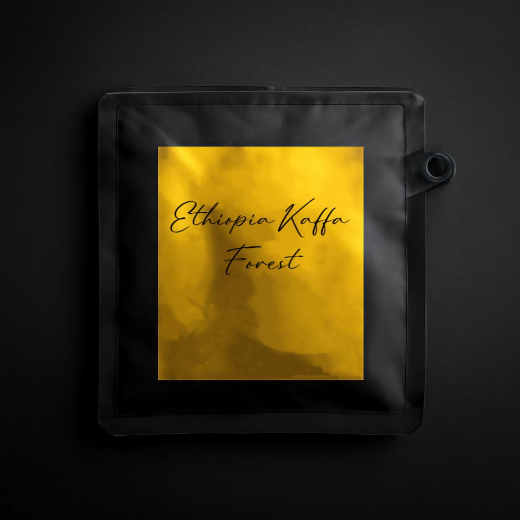 Black coffee bag with 'Ethiopia Kaffa Forest' text on a gold label against a black background